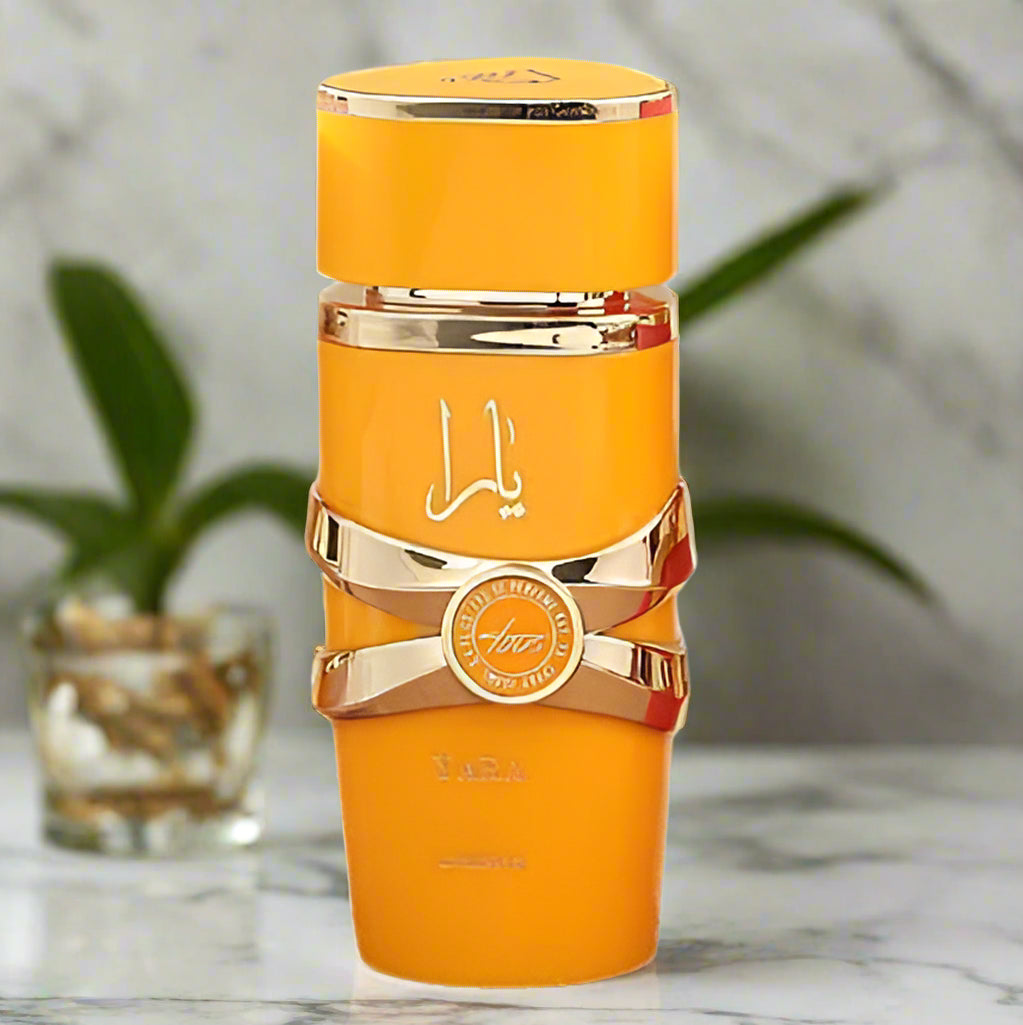 Orange and gold perfume bottle with a visible brand logo on a white background