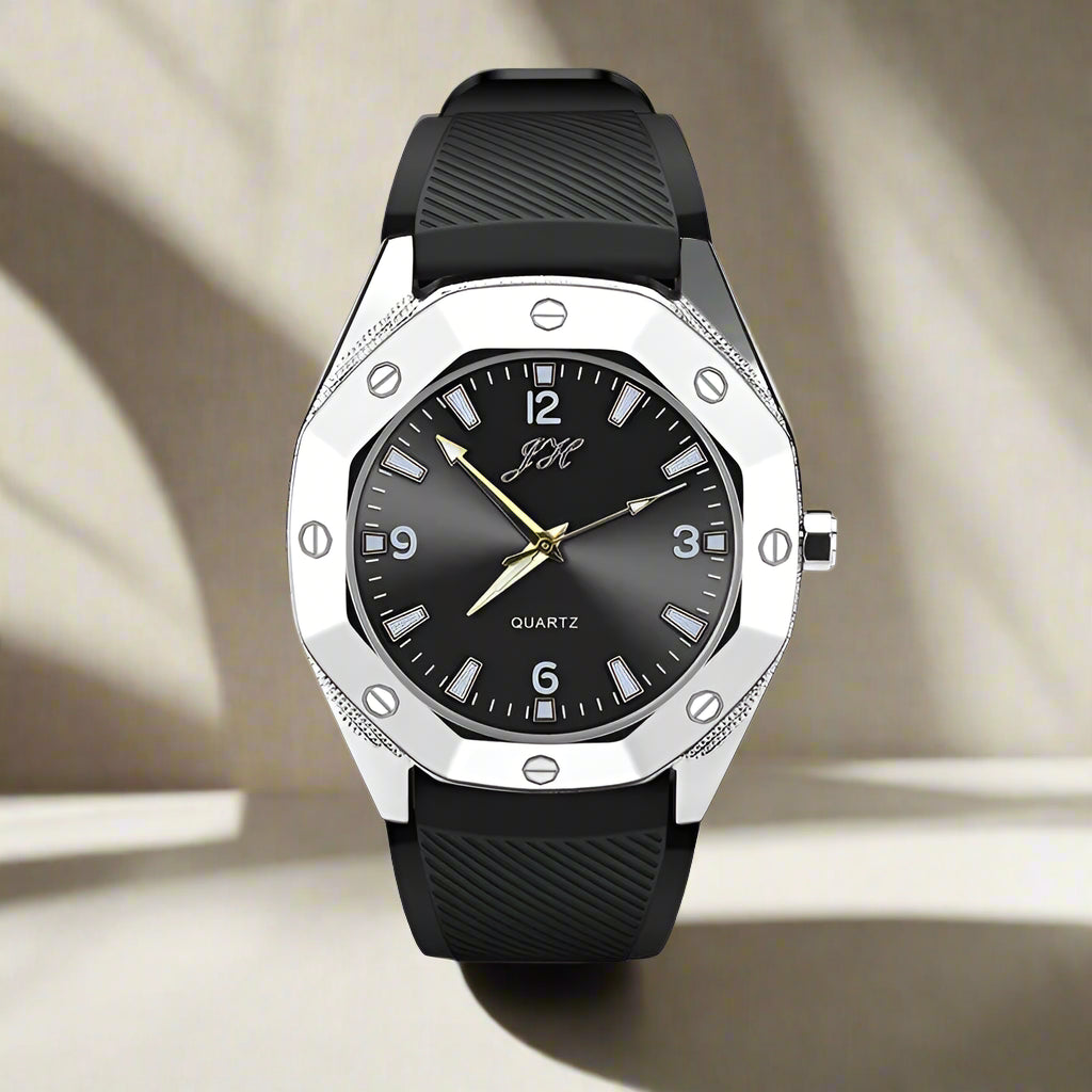 Black watch with silver case and black strap on a white background