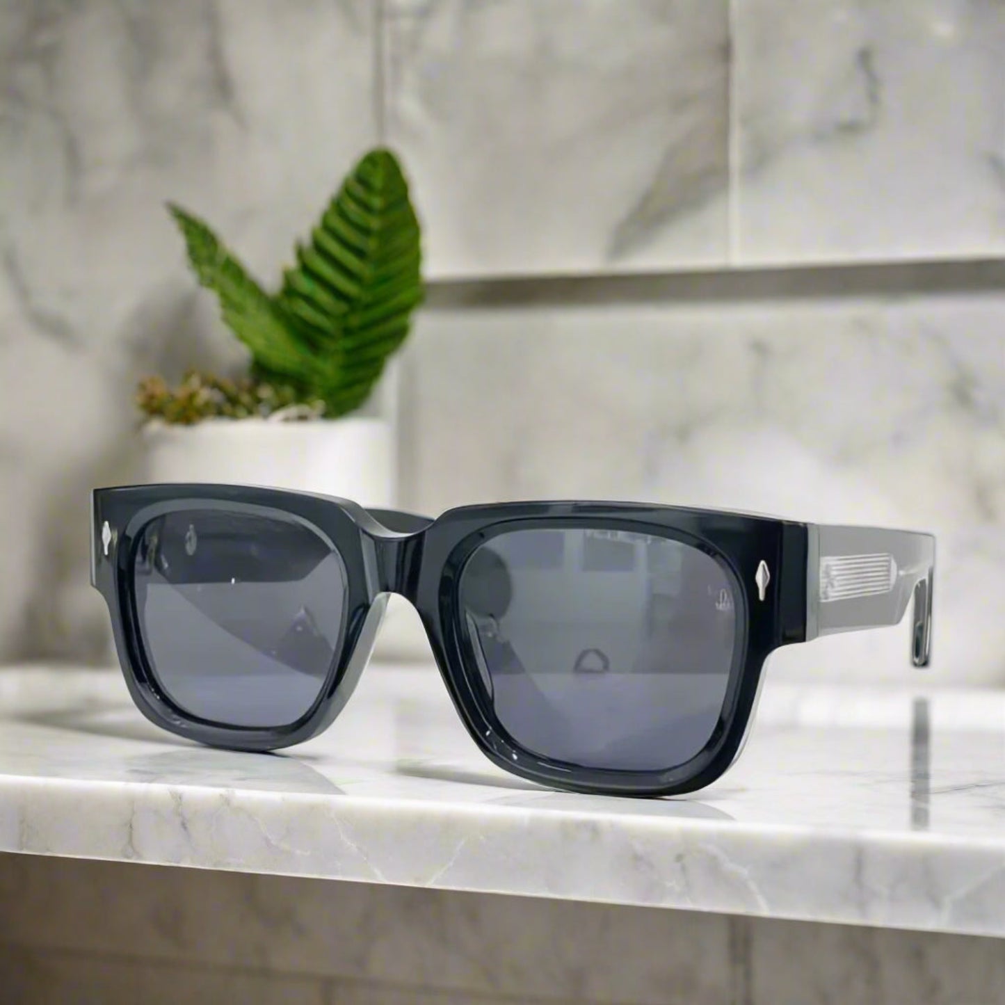 Black sunglasses with a reflective surface on a white background