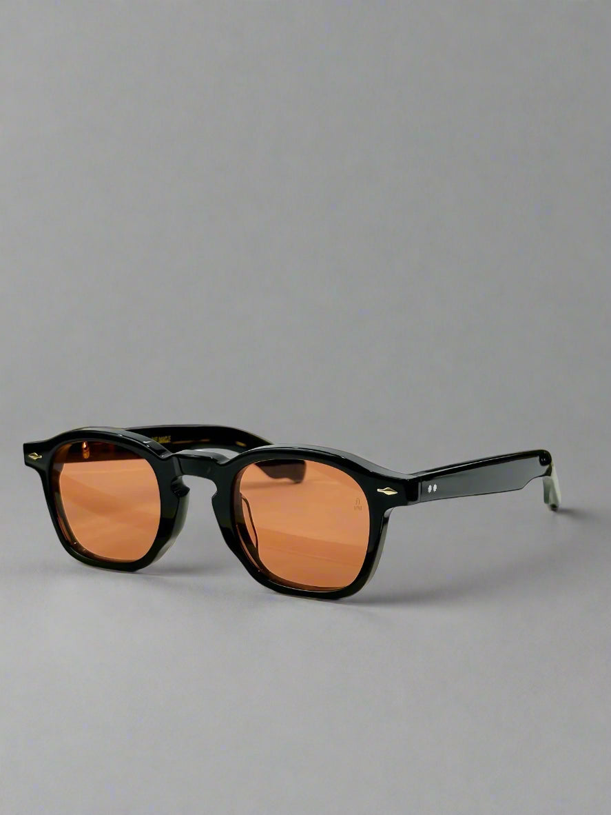 Sunglasses with a gold frame and brown lenses on a white surface, with 'ZEPHIRIN' branding.