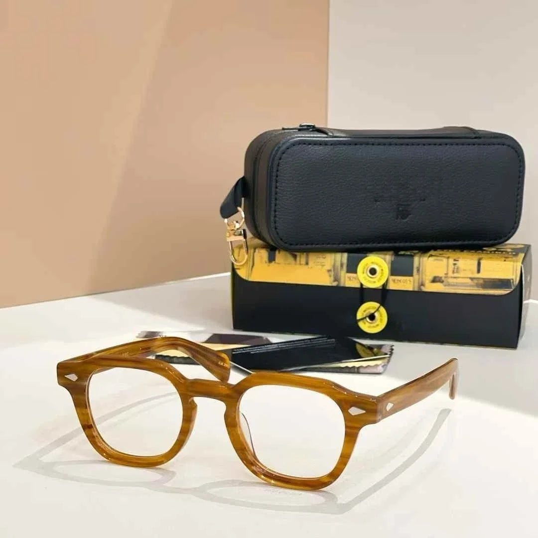 Brown eyeglasses with a black carrying case on a white surface