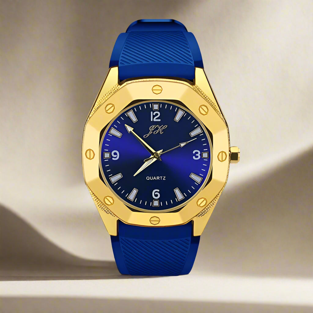 Gold-framed watch with blue strap and face on a white background