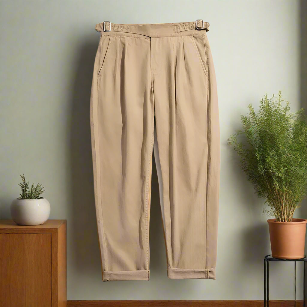 Beige pants with a belt on a white background