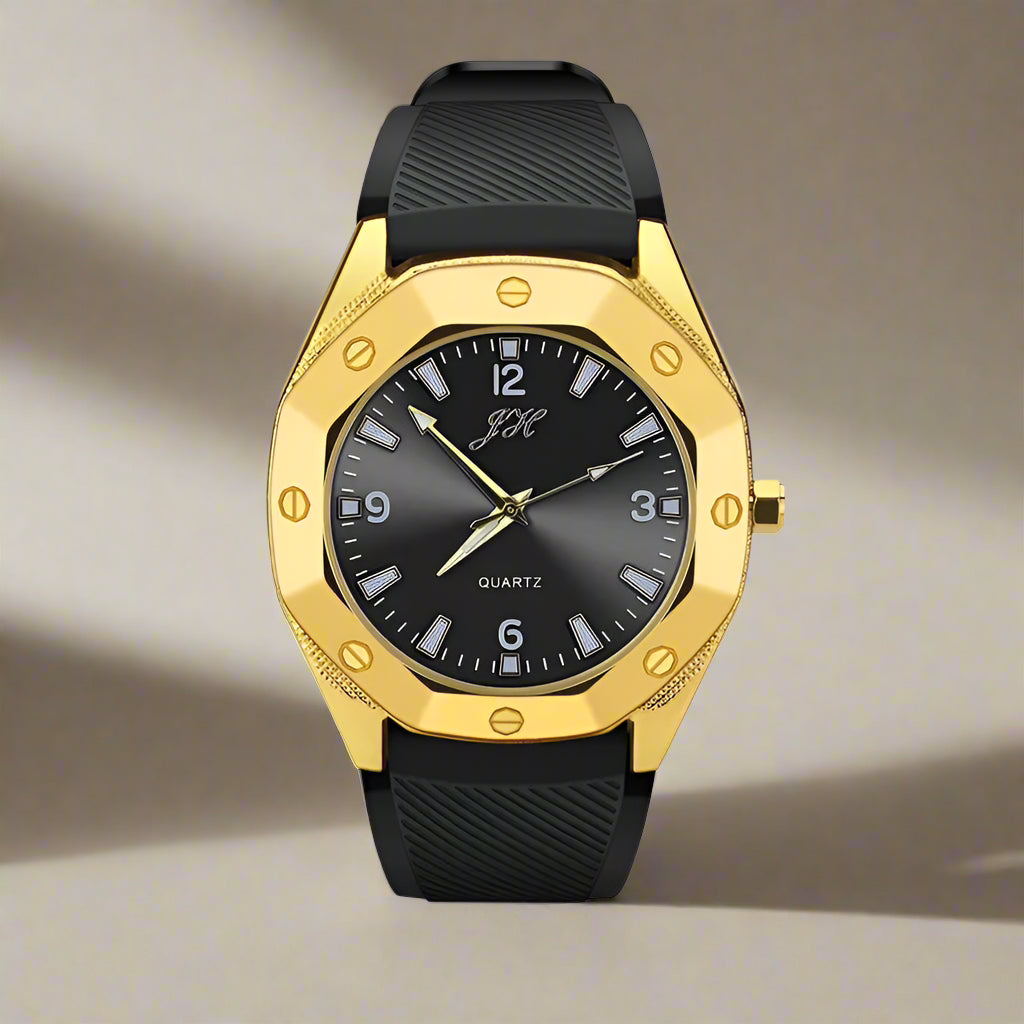 Gold and black watch with a reflective surface on a white background