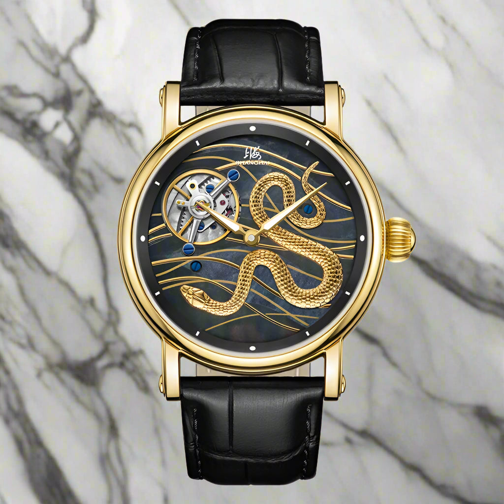 Shanghai brand watch with black leather strap and gold detailed face on white background