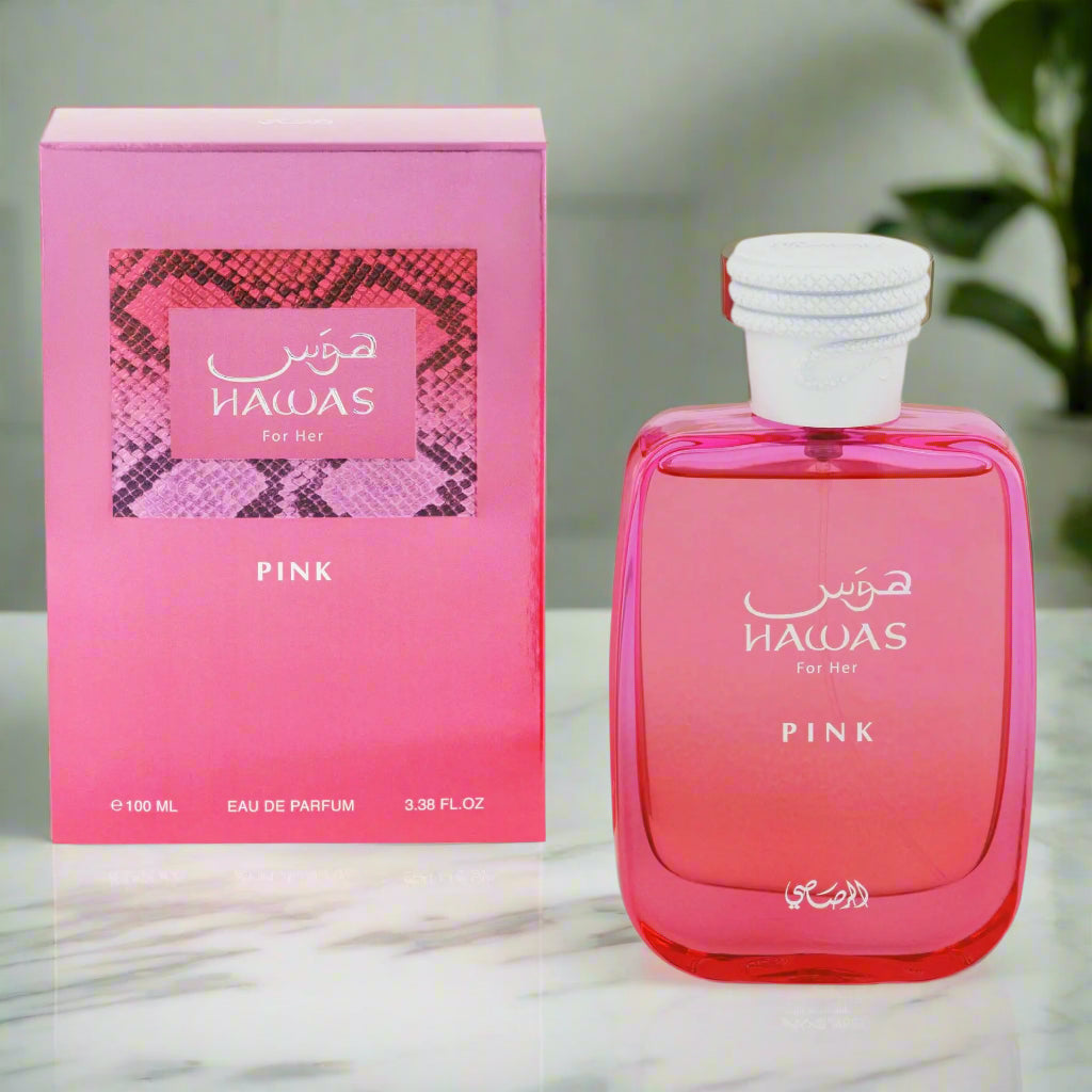 Pink HAWAS perfume bottle and packaging on a white background