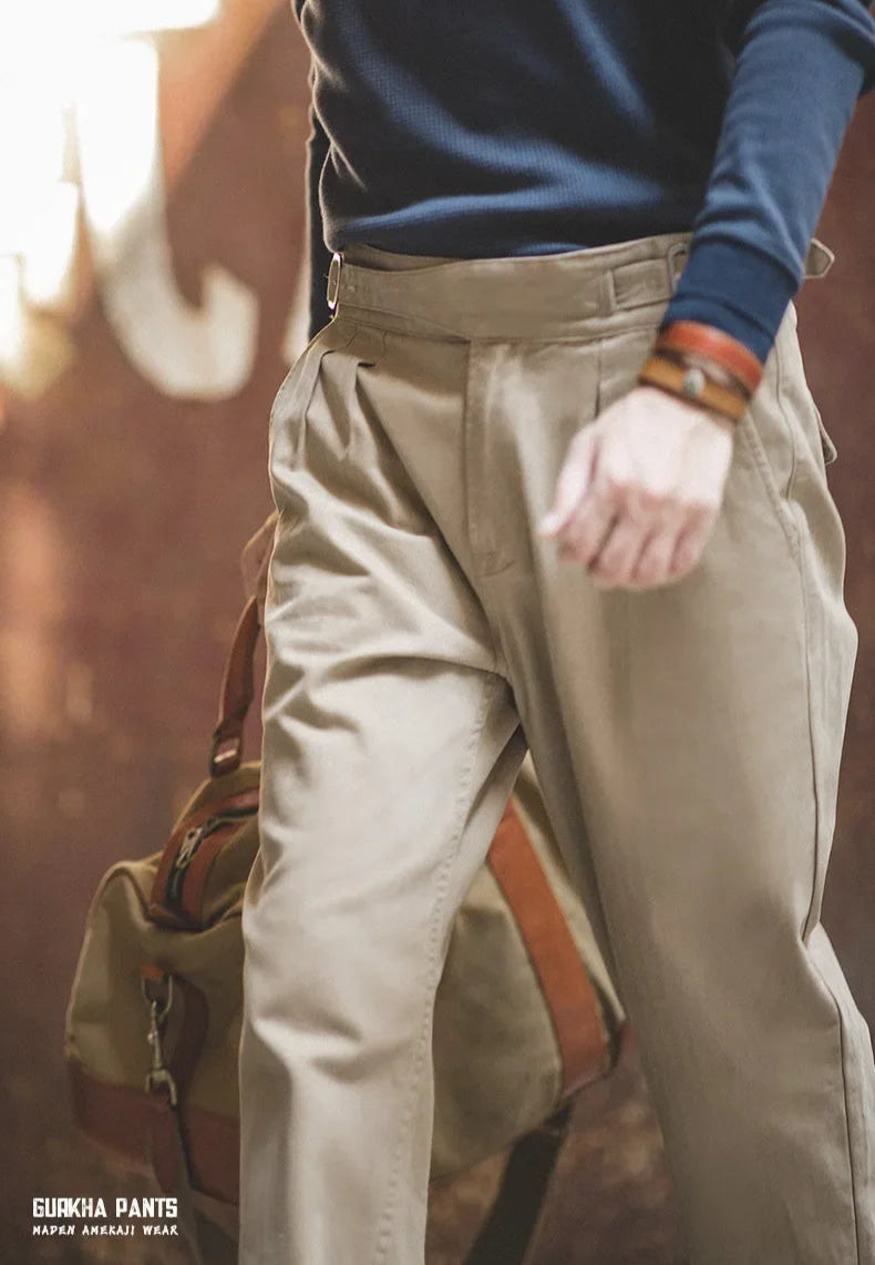 Person wearing beige pants with a blurred background