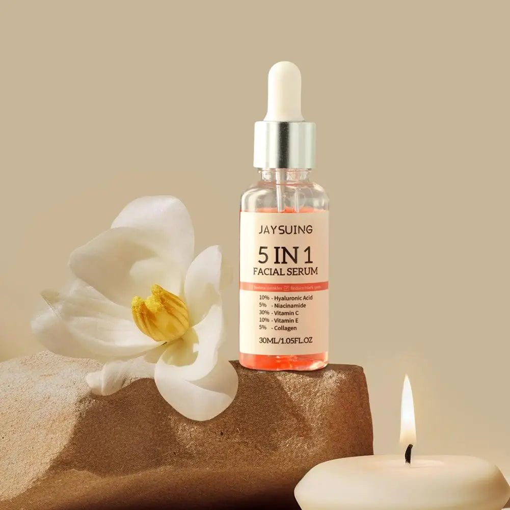 Facial serum bottle labeled 'JAYSUING 5IN1 FACIAL SERUM' with a white flower and candle on a beige background