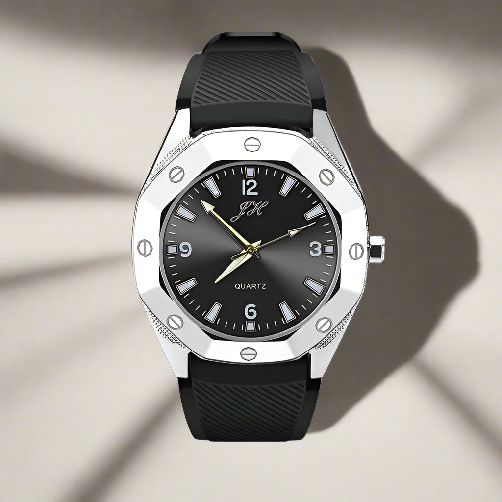 Black watch with silver case and black strap on a white background