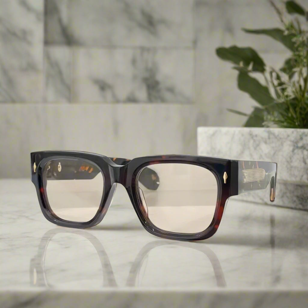 Sunglasses with tortoiseshell frame and reflective lenses on a white background
