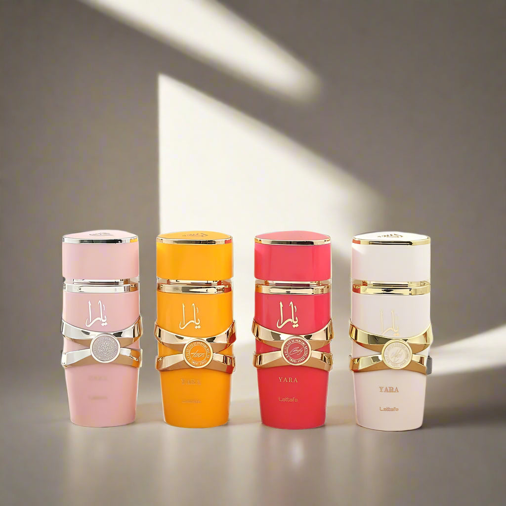 Four colorful bottles with gold accents on a white background