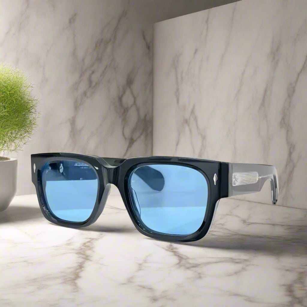 Black sunglasses with blue lenses on a white background