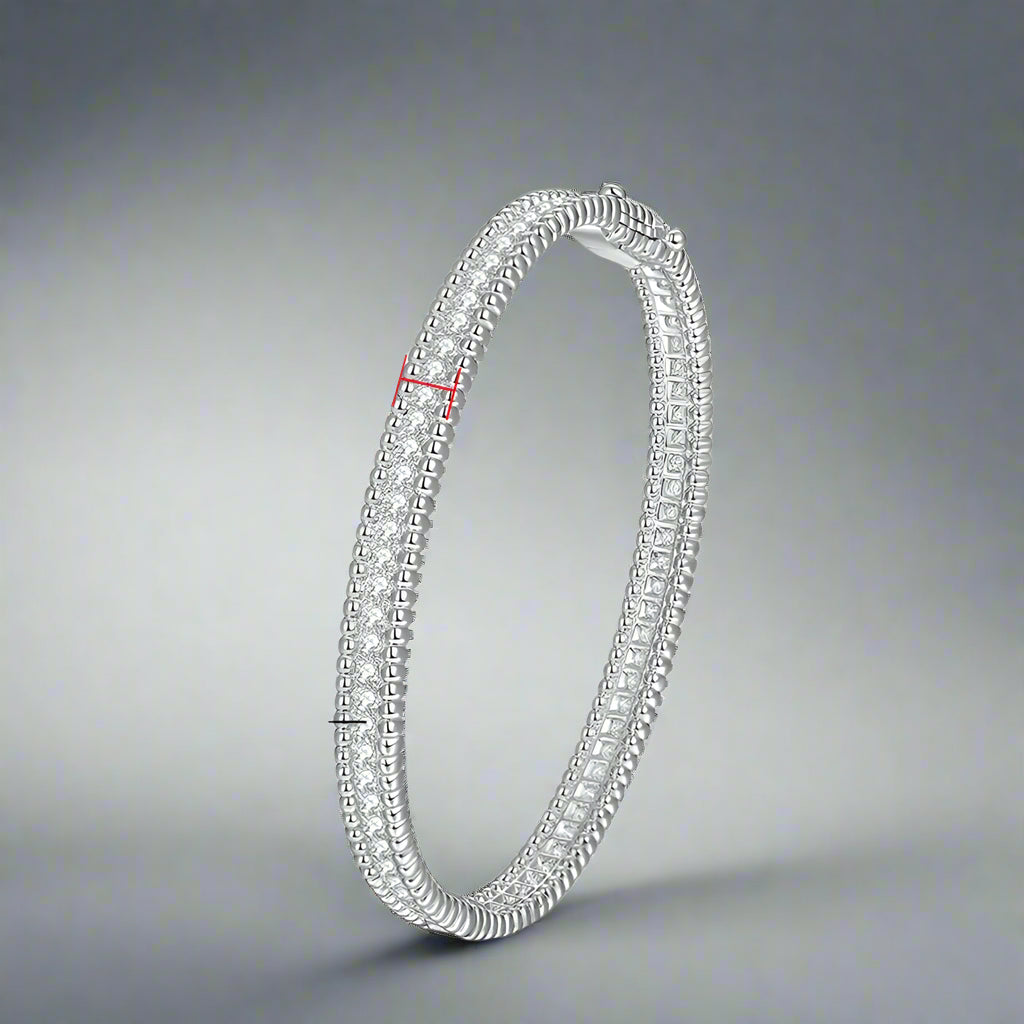 Silver bracelet with moissanite stones, showing size and material details.