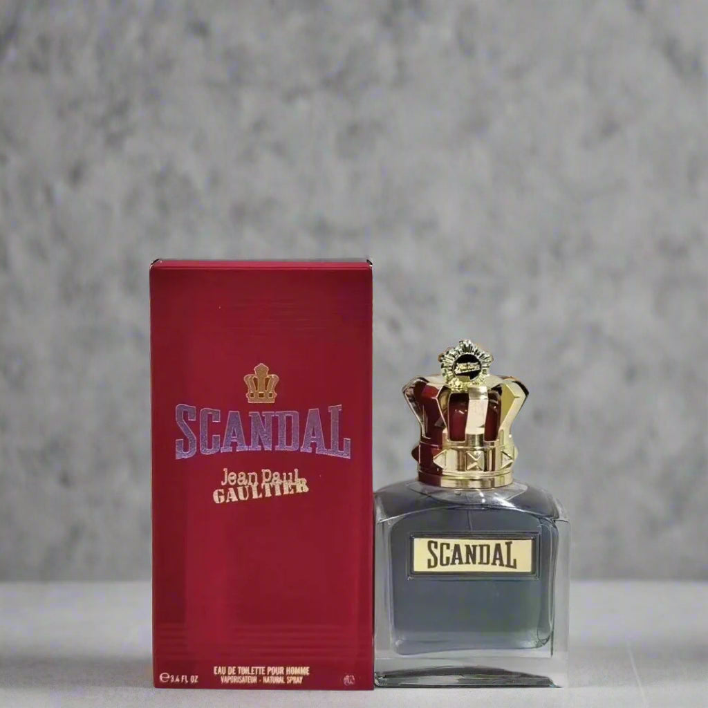 Scandal perfume bottle and packaging on a light gray background