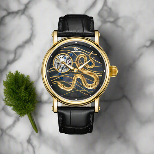 Shanghai watch with black leather strap and gold detailing on a red background