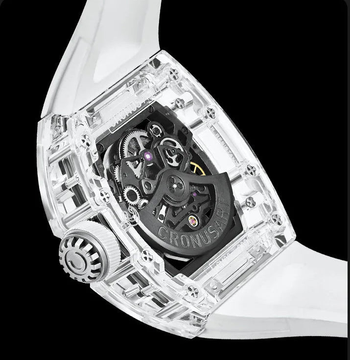 Luxury watch with transparent case and white strap on black background
